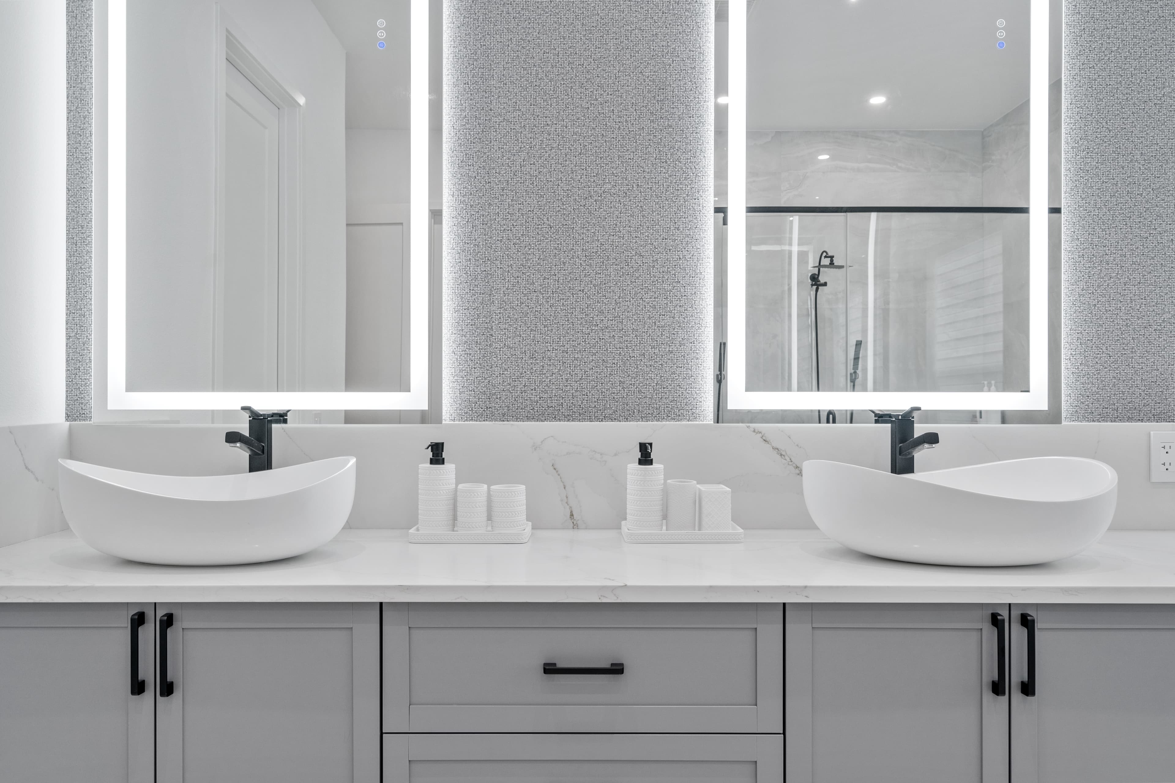 Luxe Bathroom with Illuminated Mirrors