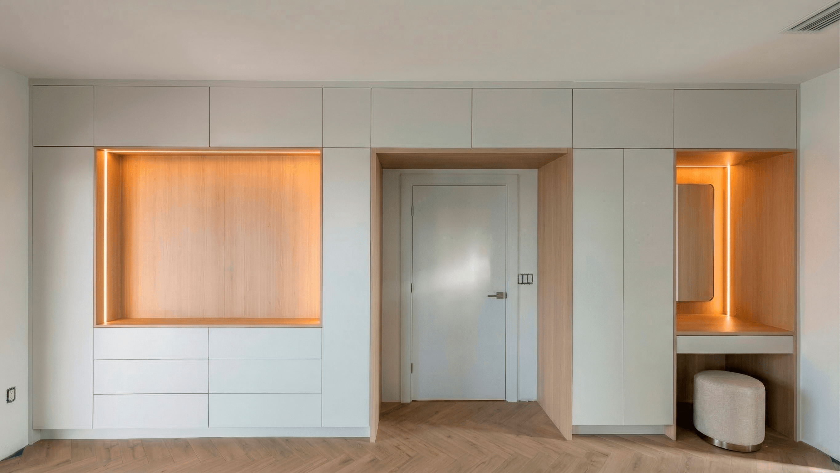 Refined bedroom with backlit display niches