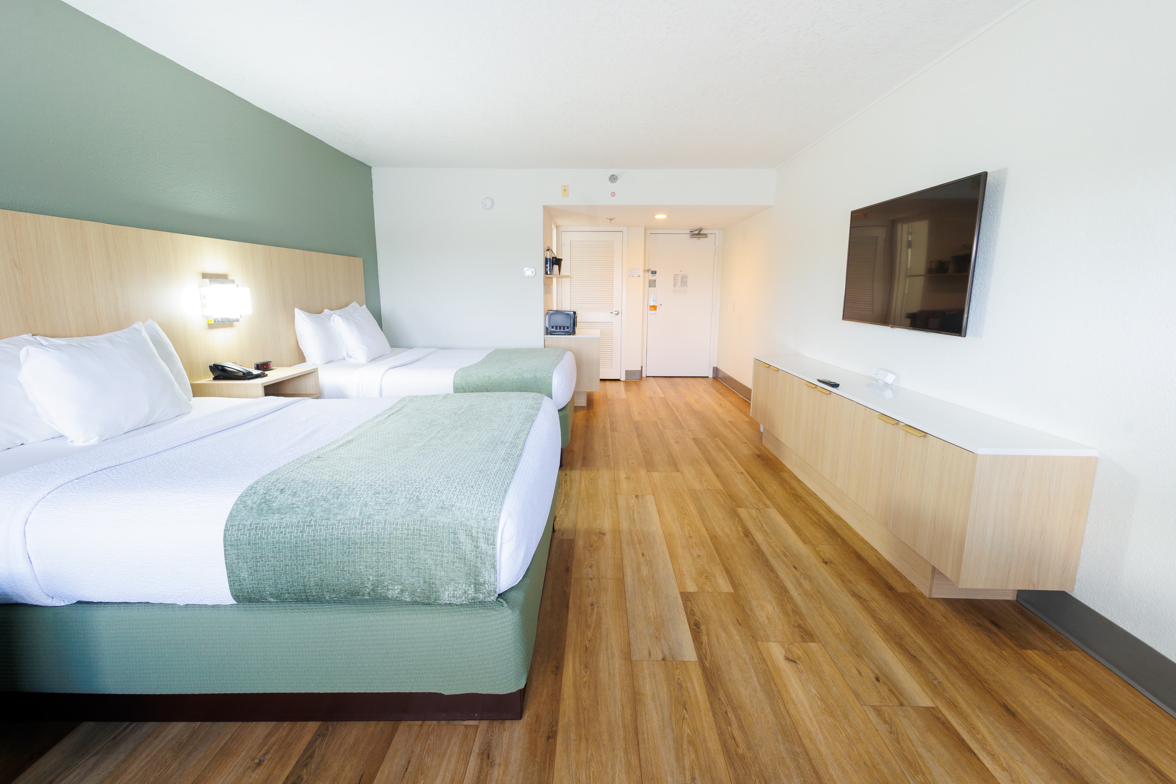 Modern Guest Room with Custom Headwall